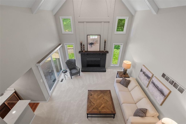 1807 Brookcreek Ln, Kirkwood, MO 63122 - carpeted living room featuring a towering ceiling, beam ceiling, and a brick fireplace