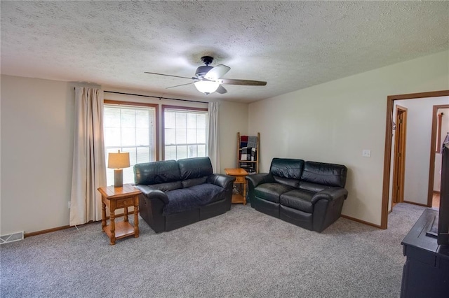 27467 Spruce Rd, Greenfield, IL 62044 - living area with a ceiling fan, carpet, a textured ceiling, and baseboards