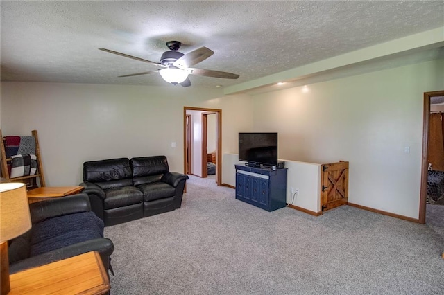 27467 Spruce Rd, Greenfield, IL 62044 - carpeted living room with a textured ceiling, a ceiling fan, and baseboards
