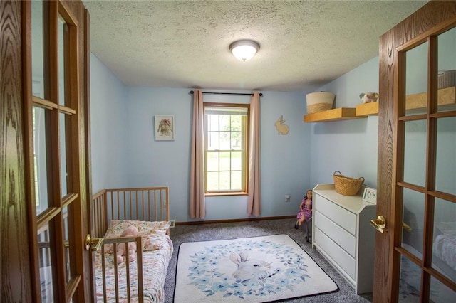 27467 Spruce Rd, Greenfield, IL 62044 - carpeted bedroom featuring french doors, a textured ceiling, and baseboards
