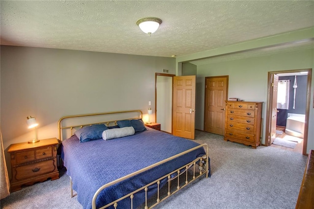 27467 Spruce Rd, Greenfield, IL 62044 - carpeted bedroom with a textured ceiling and ensuite bathroom