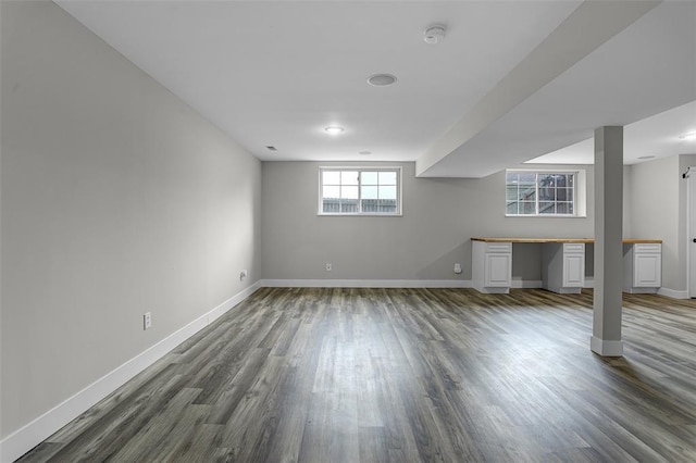 basement with wood finished floors and baseboards