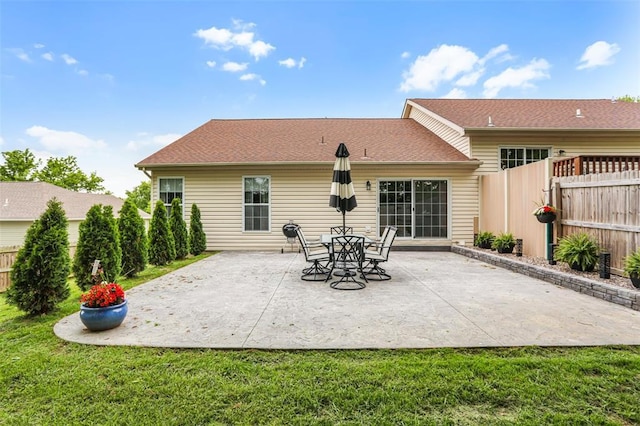 back of property featuring a patio
