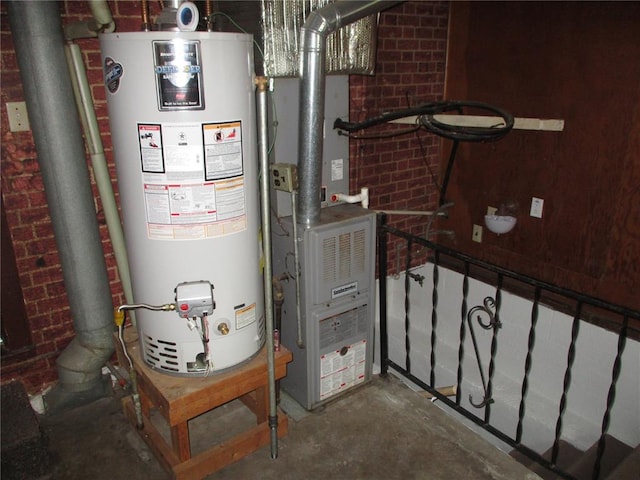 utility room featuring gas water heater