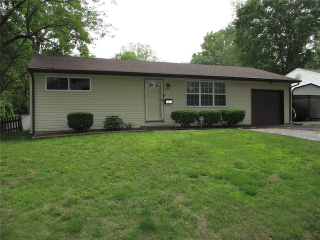 ranch-style house featuring a garage and driveway