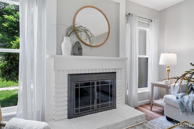 193 Harbor View Dr, Lake St Louis, MO 63367 - detailed view of a brick fireplace and wood finished floors