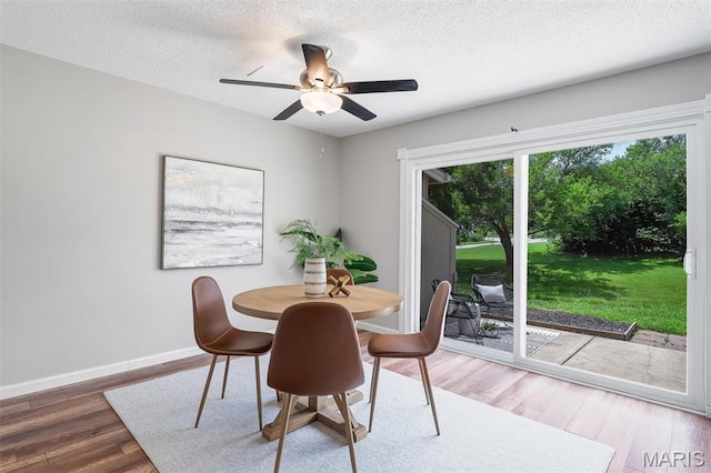 193 Harbor View Dr, Lake St Louis, MO 63367 - dining room with wood finished floors, ceiling fan, and a textured ceiling