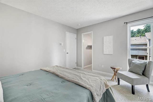 193 Harbor View Dr, Lake St Louis, MO 63367 - carpeted bedroom with a textured ceiling and a spacious closet