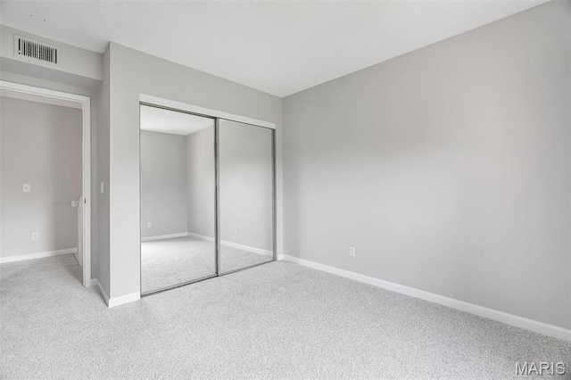 193 Harbor View Dr, Lake St Louis, MO 63367 - unfurnished bedroom featuring carpet and a closet