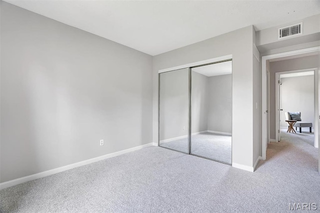 193 Harbor View Dr, Lake St Louis, MO 63367 - unfurnished bedroom featuring carpet flooring and a closet