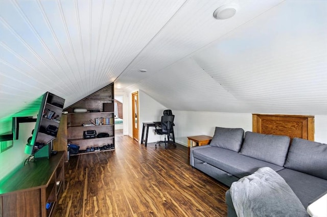 living room with wood finished floors and vaulted ceiling