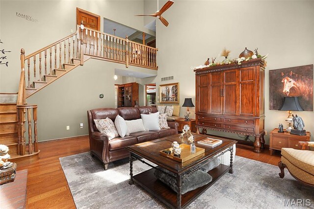 1553 Ridge Rd, Wildwood, MO 63021 - living area with a high ceiling, stairway, wood finished floors, and ceiling fan