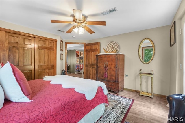 1553 Ridge Rd, Wildwood, MO 63021 - bedroom featuring wood finished floors, a ceiling fan, and a closet