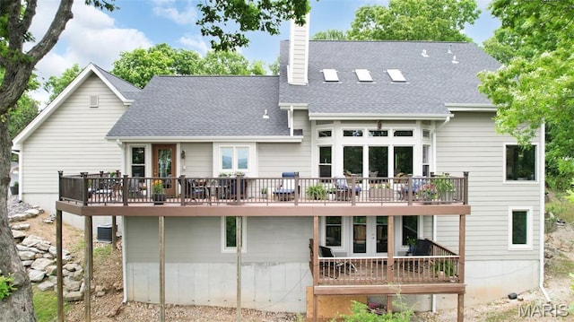 1553 Ridge Rd, Wildwood, MO 63021 - rear view of house featuring a wooden deck, a chimney, roof with shingles, and french doors