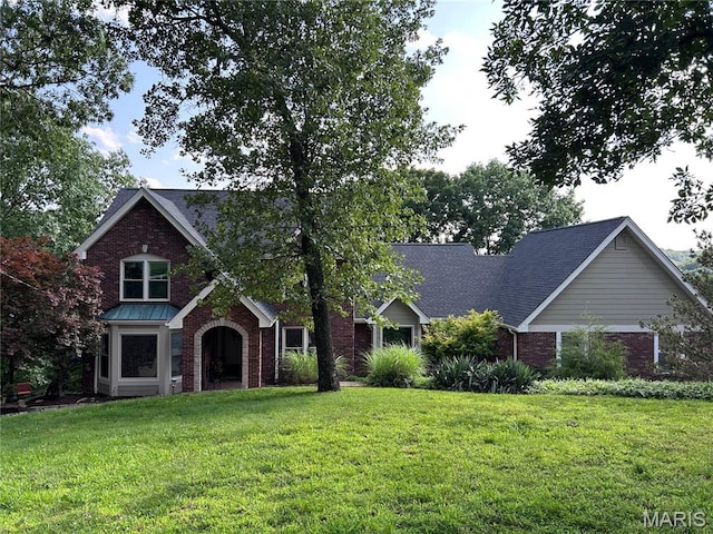 1553 Ridge Rd, Wildwood, MO 63021 - view of front of house featuring brick siding, a front lawn, and a shingled roof
