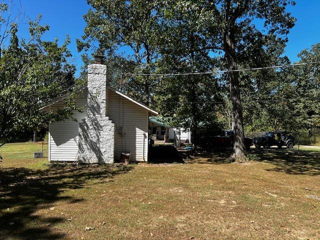 756 Eldon Dr, Bismarck, MO 63624 - view of home's exterior featuring a yard and a chimney