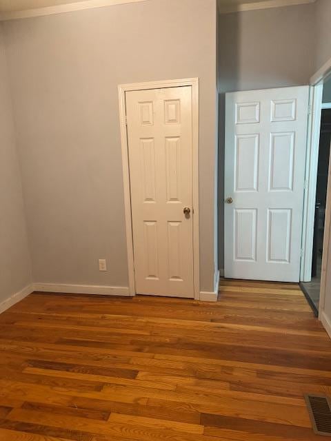 756 Eldon Dr, Bismarck, MO 63624 - unfurnished bedroom with ornamental molding, wood finished floors, and baseboards