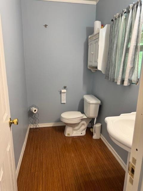 756 Eldon Dr, Bismarck, MO 63624 - bathroom with baseboards, toilet, and wood finished floors