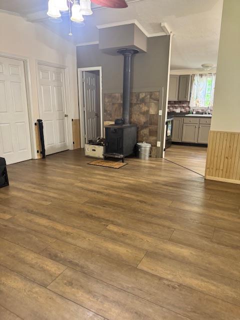 756 Eldon Dr, Bismarck, MO 63624 - living area featuring a wood stove, wood-type flooring, and a chandelier