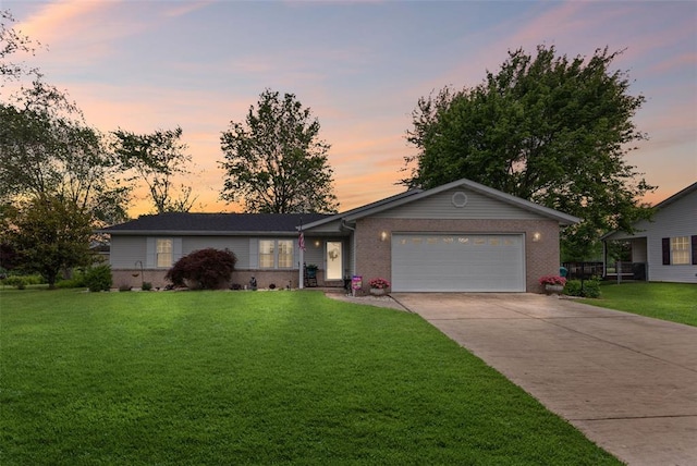 ranch-style house with a garage, driveway, a front yard, and brick siding