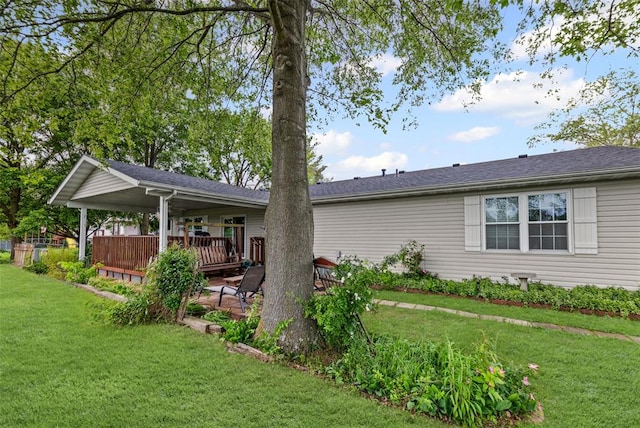 back of house with a yard and a wooden deck