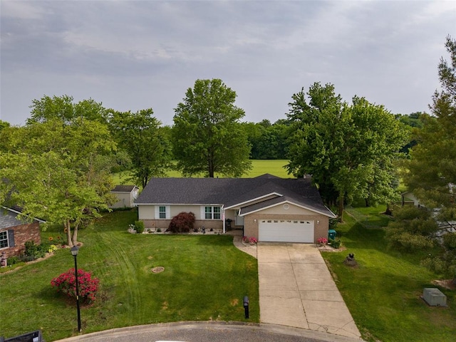 ranch-style home with a garage, concrete driveway, a front lawn, and brick siding