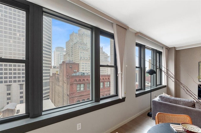 915 Olive St Unit 910, Saint Louis, MO 63101 - sitting room featuring wood finished floors and a skyline view