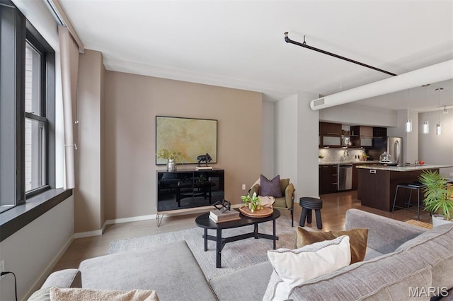 915 Olive St Unit 910, Saint Louis, MO 63101 - living area featuring light wood-style floors and plenty of natural light