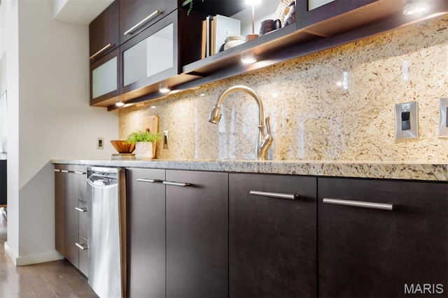 915 Olive St Unit 910, Saint Louis, MO 63101 - kitchen featuring dark brown cabinets, tasteful backsplash, and dishwasher