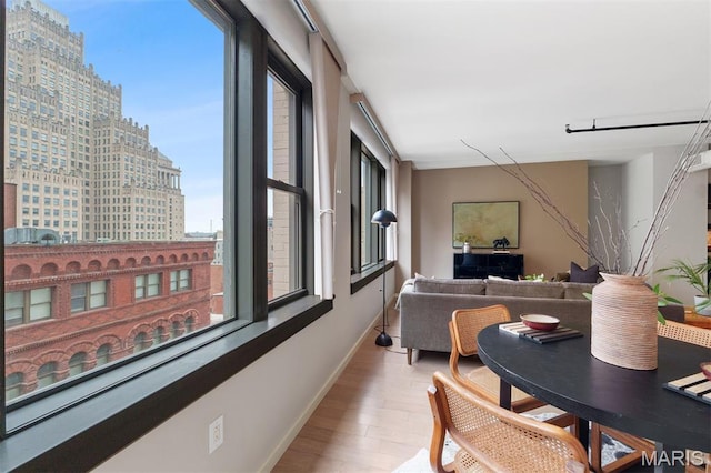 915 Olive St Unit 910, Saint Louis, MO 63101 - living room featuring wood finished floors and baseboards