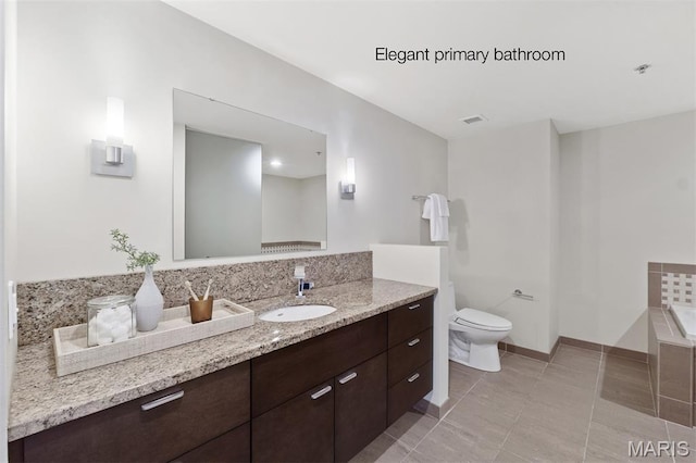 915 Olive St Unit 910, Saint Louis, MO 63101 - full bathroom featuring vanity, tile patterned flooring, and a tub