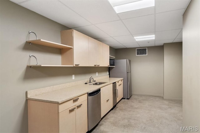 915 Olive St Unit 910, Saint Louis, MO 63101 - kitchen with appliances with stainless steel finishes, open shelves, a drop ceiling, light countertops, and light colored carpet