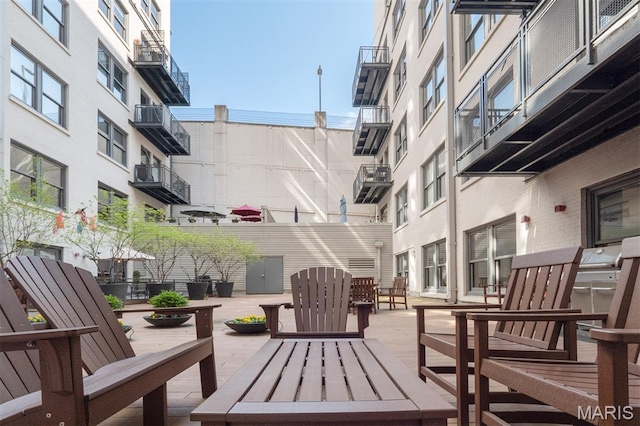 915 Olive St Unit 910, Saint Louis, MO 63101 - wooden terrace featuring a patio