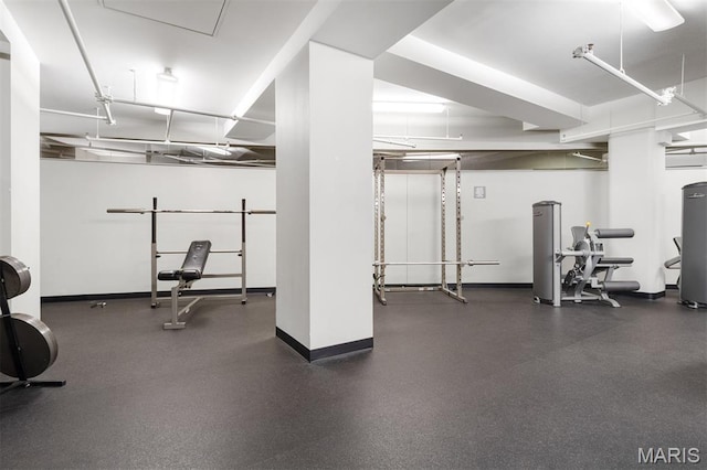 915 Olive St Unit 910, Saint Louis, MO 63101 - exercise room featuring baseboards