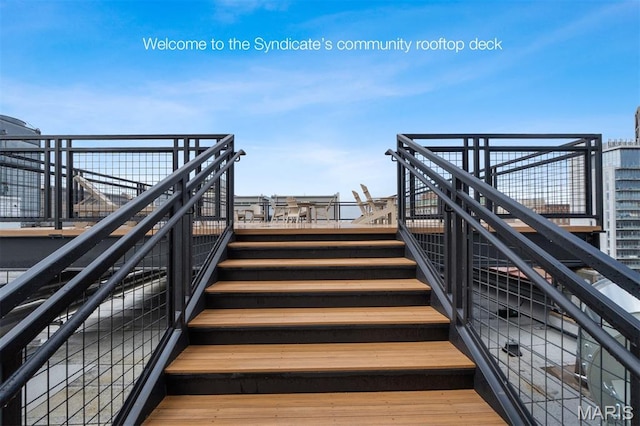915 Olive St Unit 910, Saint Louis, MO 63101 - view of community featuring stairs and a deck