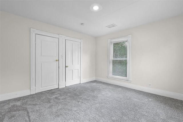 unfurnished bedroom with carpet flooring, baseboards, and recessed lighting