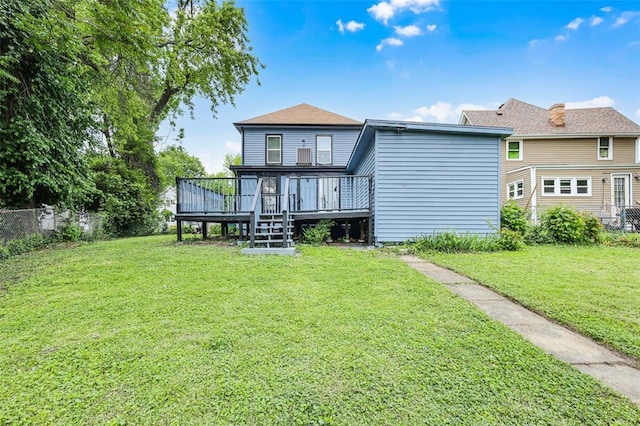 back of house with a wooden deck
