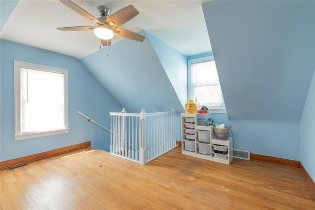 1201 Milton Rd, Alton, IL 62002 - additional living space featuring hardwood / wood-style flooring, a ceiling fan, baseboards, and vaulted ceiling
