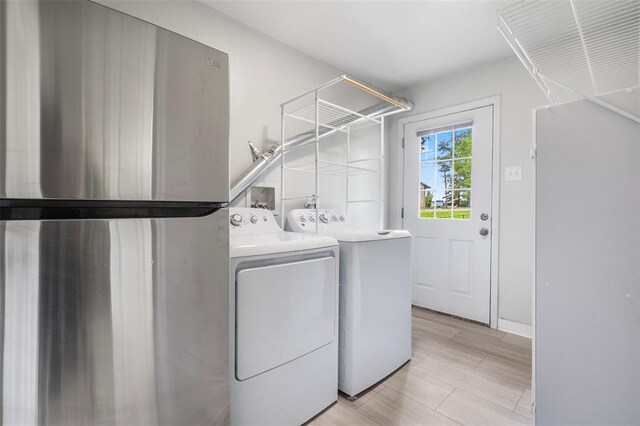 laundry area with washer and clothes dryer