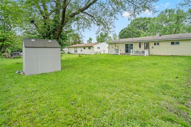 view of yard featuring a shed and an outdoor structure