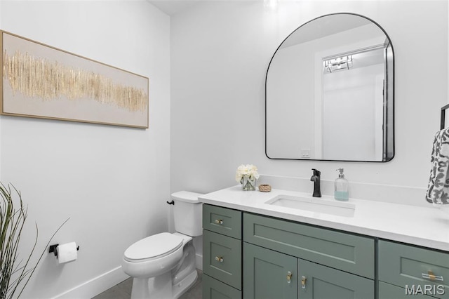 401 Rayburn Ave, Sunset Hills, MO 63127 - bathroom featuring vanity, toilet, and baseboards