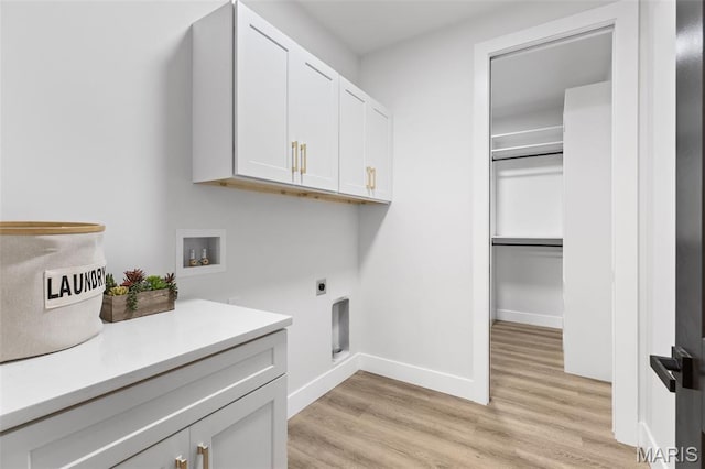 401 Rayburn Ave, Sunset Hills, MO 63127 - laundry area with cabinet space, hookup for a washing machine, electric dryer hookup, light wood finished floors, and baseboards