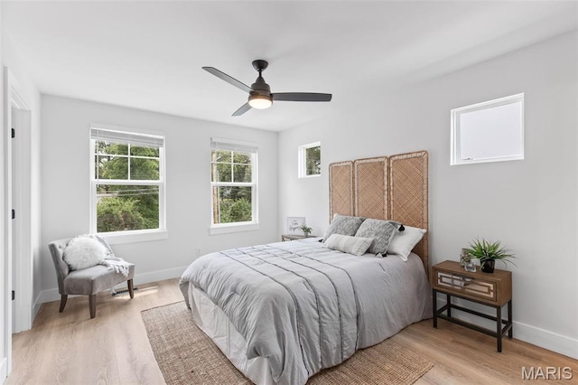 401 Rayburn Ave, Sunset Hills, MO 63127 - bedroom featuring light wood-style flooring, baseboards, and a ceiling fan