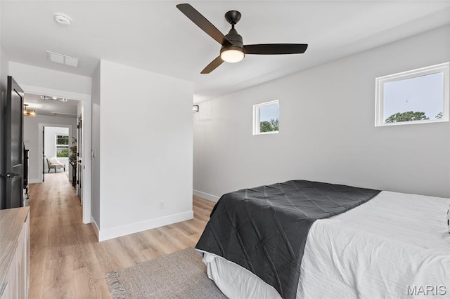 401 Rayburn Ave, Sunset Hills, MO 63127 - bedroom with baseboards, light wood finished floors, attic access, and ceiling fan