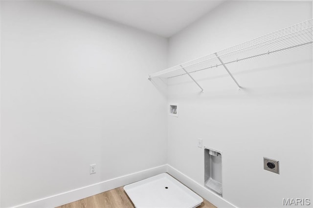 401 Rayburn Ave, Sunset Hills, MO 63127 - laundry room with electric dryer hookup, hookup for a washing machine, light wood-style flooring, and baseboards