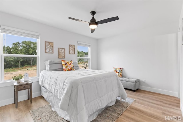 401 Rayburn Ave, Sunset Hills, MO 63127 - bedroom with light wood-style floors, baseboards, and a ceiling fan