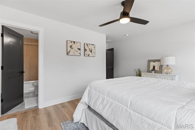 401 Rayburn Ave, Sunset Hills, MO 63127 - bedroom with wood finished floors, baseboards, a ceiling fan, and ensuite bath