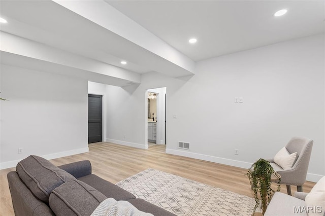 401 Rayburn Ave, Sunset Hills, MO 63127 - living room with baseboards, light wood finished floors, and recessed lighting
