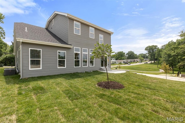 401 Rayburn Ave, Sunset Hills, MO 63127 - rear view of house featuring a yard, central AC, and roof with shingles