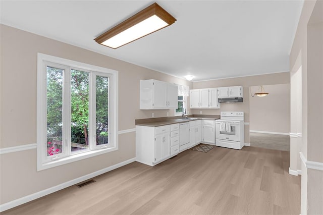 kitchen featuring white appliances, under cabinet range hood, light wood finished floors, white cabinetry, and baseboards